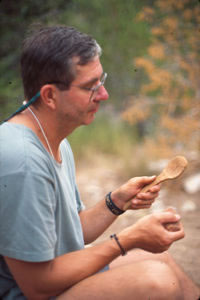 Finishing a spoon made from cottonwood bark.